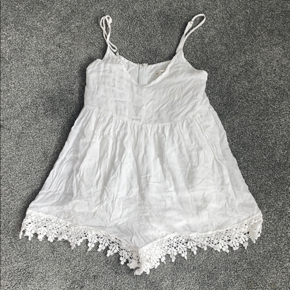 Flowy white romper with crotchet detailing